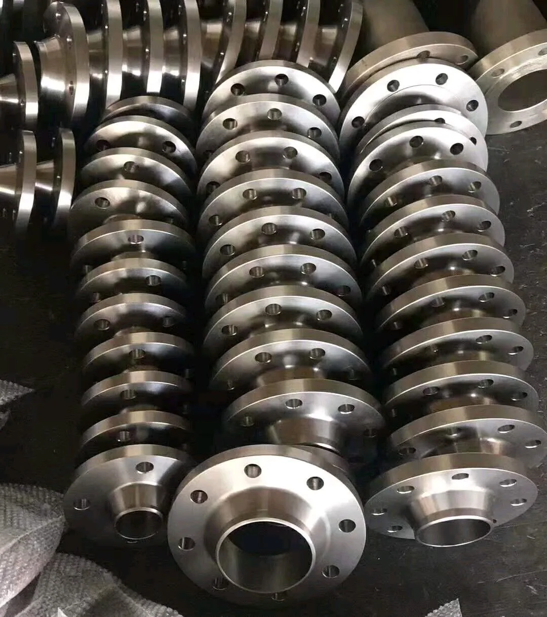 A set of titanium flanges of different diameters