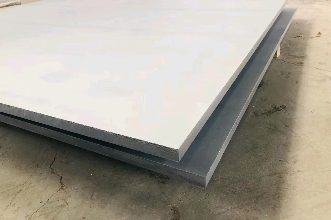 Bundled titanium plates stacked ready for dispatch