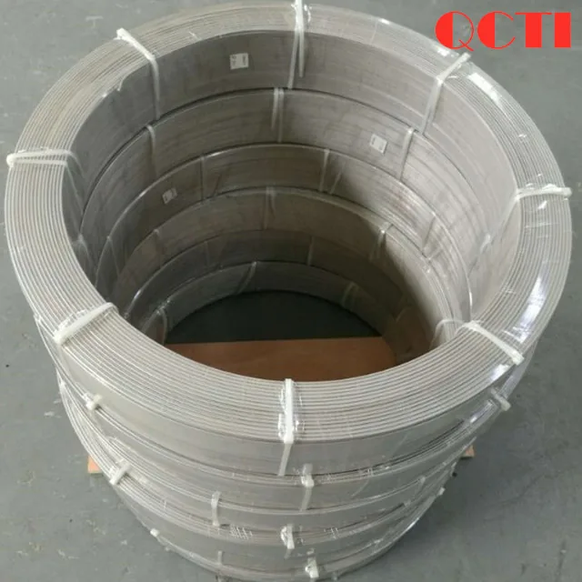 Large coil of titanium wire with a securing strap