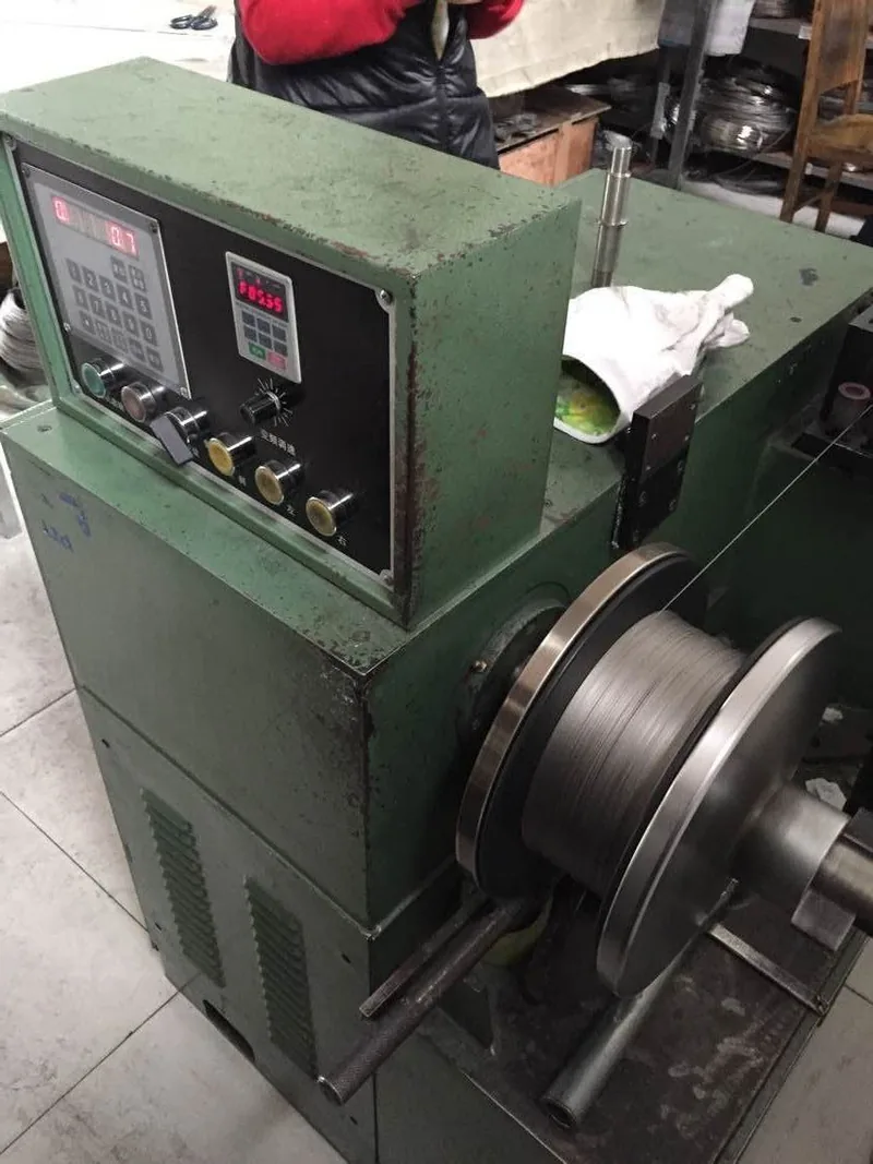 Spools of titanium wire on a rack